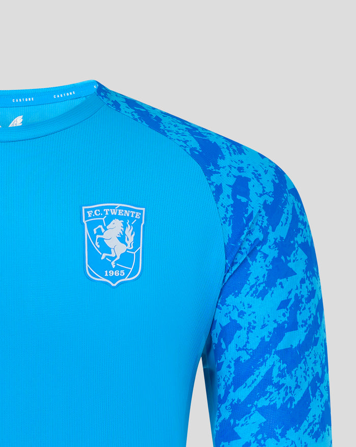 Shoulder and collar area of FC Twente blue performance jersey with camouflage sleeves and Castore branding