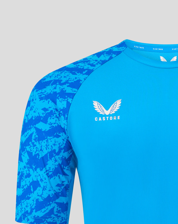 Front chest of FC Twente blue jersey featuring crest and camouflage sleeves