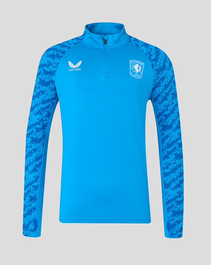 Front view of bright blue FC Twente midlayer top with patterned sleeves and team crest