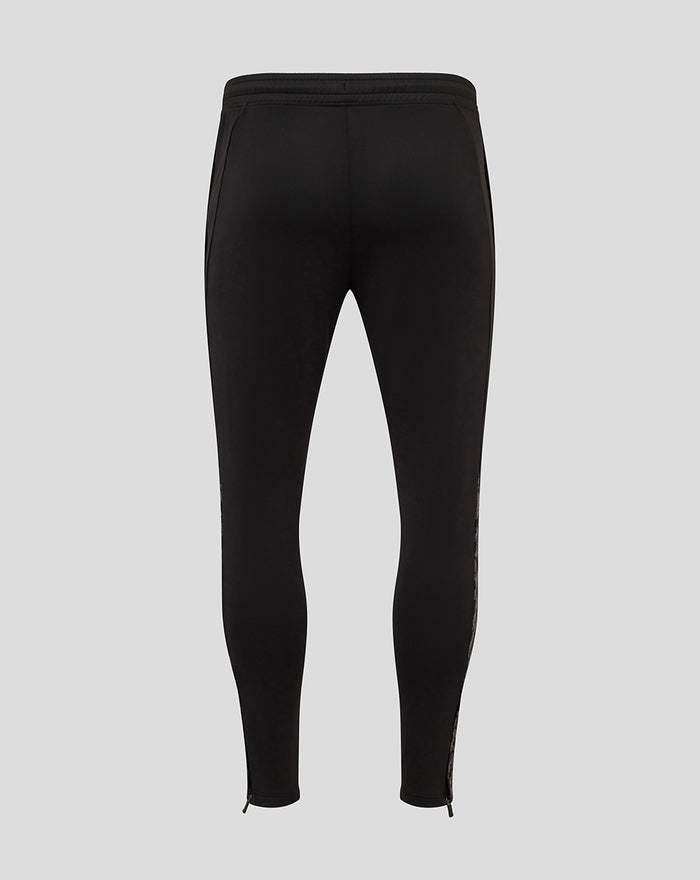 Back view of black FC Twente men's performance pants with a red club crest on the lower leg.