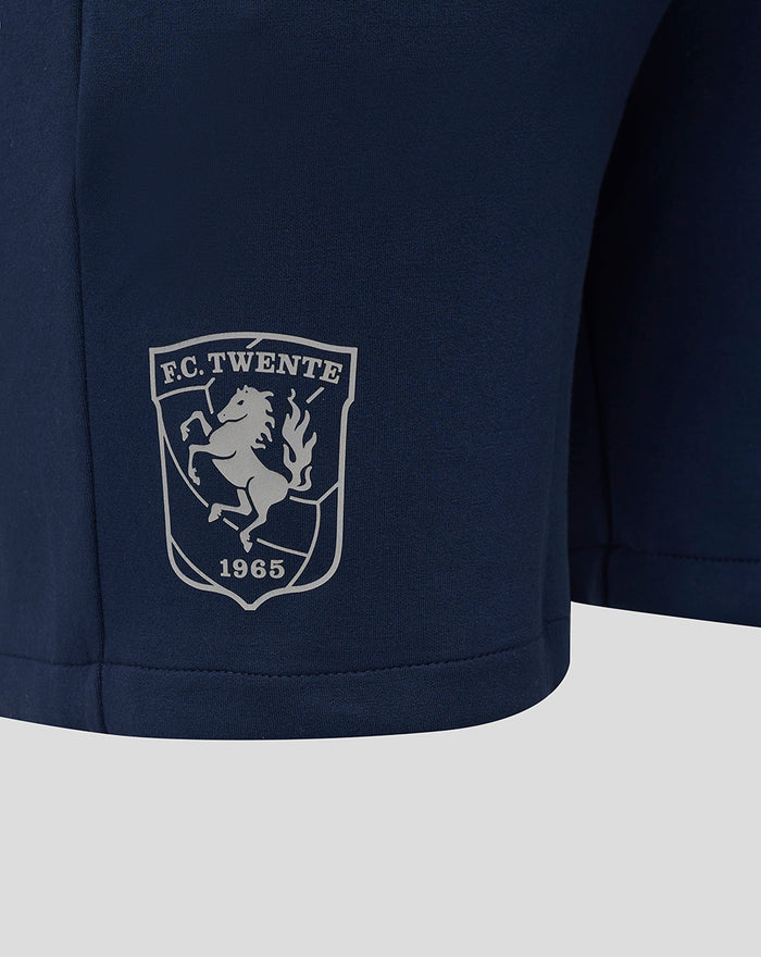 Close-up of the FC Twente crest on the navy Travel Knit Short.
