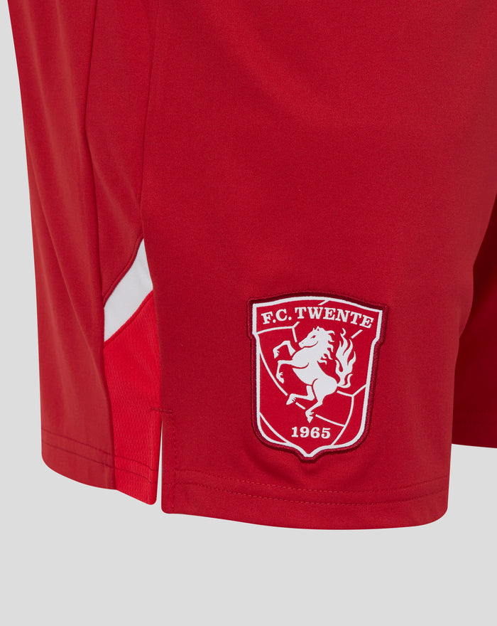 Close up of red FC Twente home shorts with club crest patch on the leg