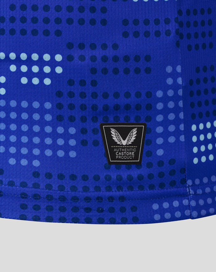 Close up of the blue dotted FC Twente shirt showing the Taurus badge on the lower chest