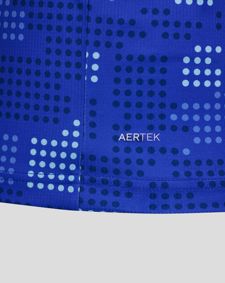 Close-up of blue FC Twente away shirt fabric showing a subtle dotted pattern and AerTek branding.