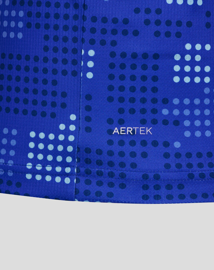 Close-up of blue FC Twente away shirt fabric showing a subtle dotted pattern and AerTek branding.