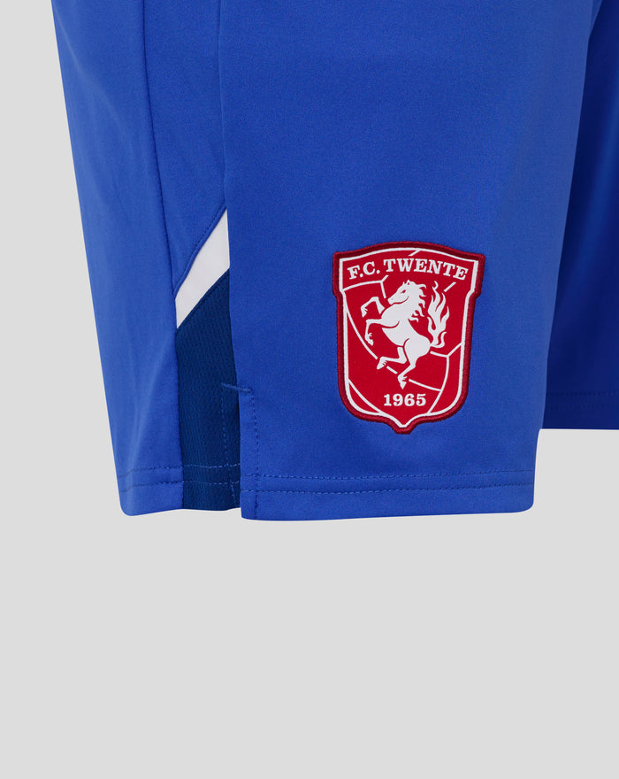 Red FC Twente crest patch sewn on blue shorts fabric