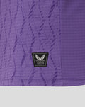 Close-up of purple FC Twente keeper shirt fabric with an authentic Castore product patch