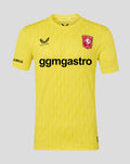 Front view of yellow FC Twente keeper shirt with crest on chest and bold sponsor text across the front