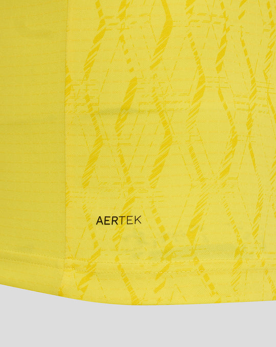 Close up of bright yellow FC Twente keeper shirt fabric with AERTEK pattern.