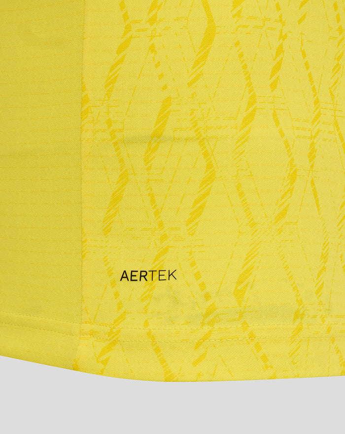 Close up of bright yellow FC Twente keeper shirt fabric with AERTEK pattern.