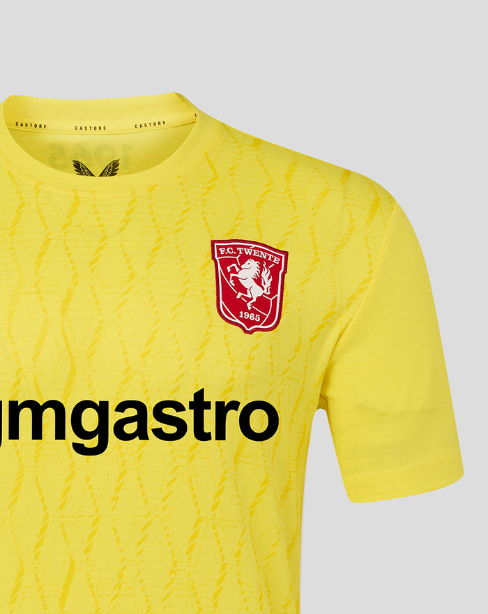 Bright yellow FC Twente keeper shirt with crest on the left chest and bold black front print.