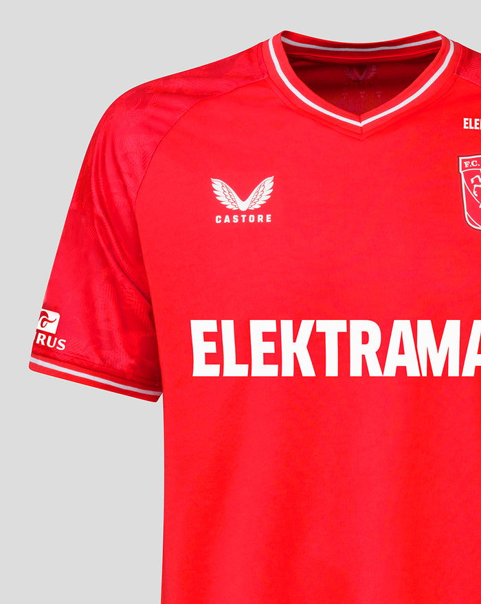 Close up of FC Twente home shirt sleeve showing a blue Vrienden Loterij patch, red fabric and white trim with Elektra sponsor across the chest