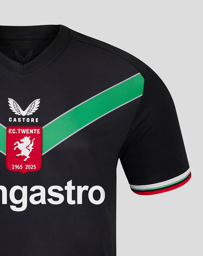 Shoulder to chest close-up of black FC Twente third shirt featuring a green diagonal stripe and crest