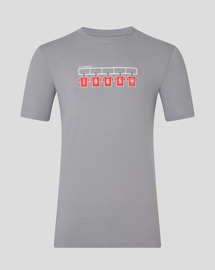 Light gray FC Twente adult T-shirt featuring a graphic of five red jerseys on a rack.