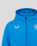 Front close-up of bright blue FC Twente jacket with crest on the left chest, Castore logo on the right, and central zipper.