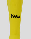 Close up of yellow FC Twente keeper sock fabric showing the 1965 year detail on the calf.