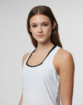 Close-up of model wearing white Active Technical Vest with black trimmed neckline.
