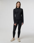 Black women's Active Technical 1/4 Zip with chest zip and thumb holes on a model