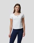 Woman in white Active Contour tee with square neckline and contoured seams