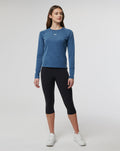 Three-quarter front view of a woman wearing the Women's Carolina Vent Long Sleeve Tee.