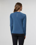 Back view of a woman modeling the Women's Carolina Vent Long Sleeve Tee for runners.