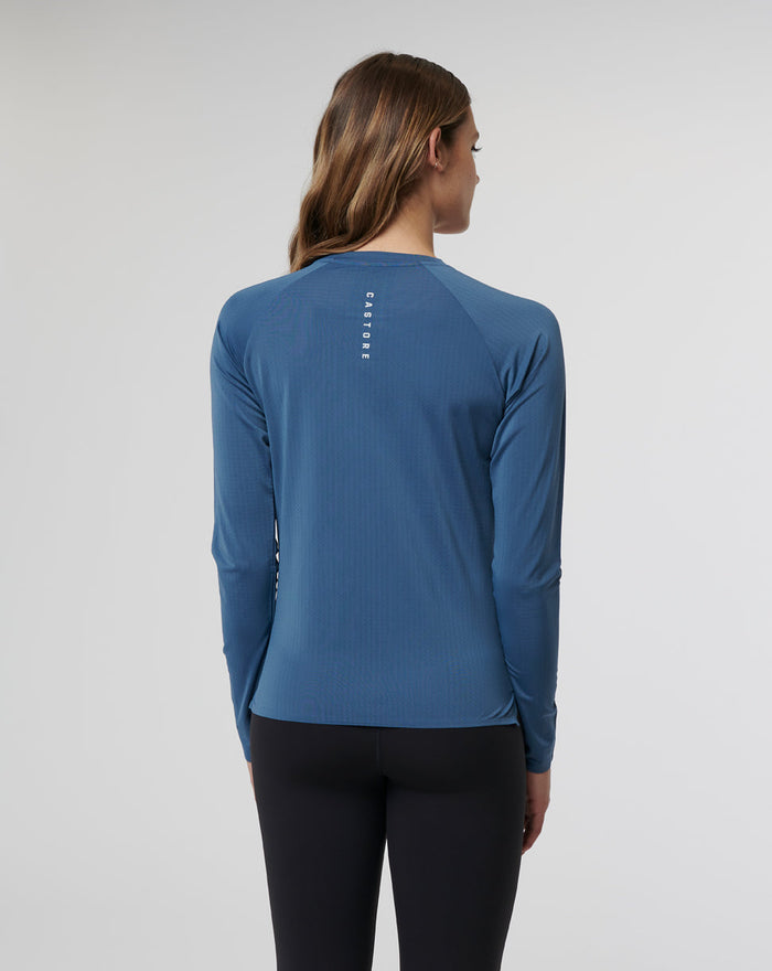 Back view of a woman modeling the Women's Carolina Vent Long Sleeve Tee for runners.