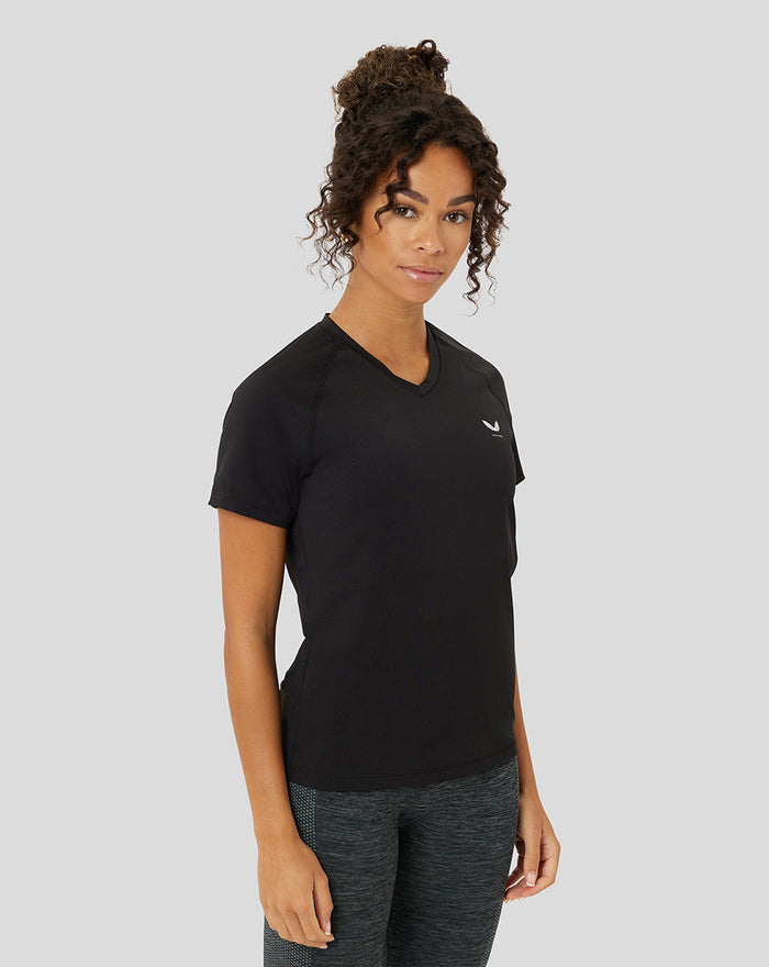 Female model wearing black Protek training T shirt with a V-neck, posing in a side view