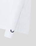 White sleeve with navy Castore wing logo at the cuff