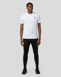 Male model in white lightweight training 1/4 zip top with concealed zip and chest logo.