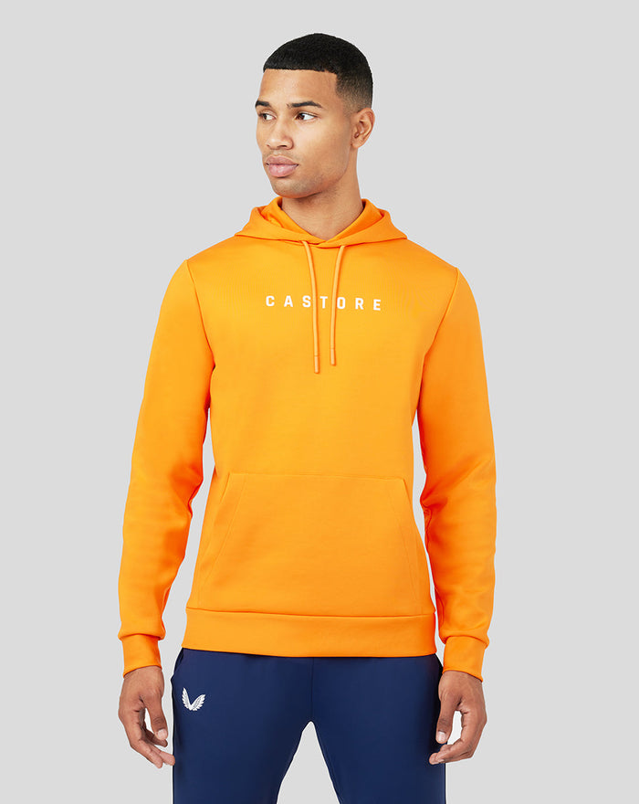 Male model in bright orange Mandarin Scuba Hoody 3.0 with white Castore logo on chest.
