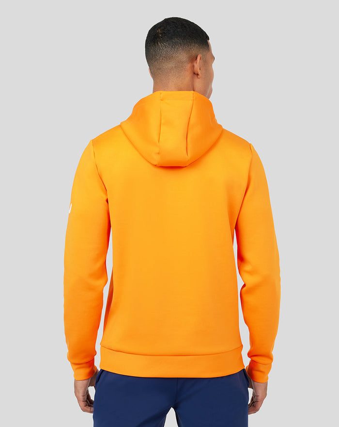Back view of bright orange Mandarin Scuba Hoody 3.0 on a model.