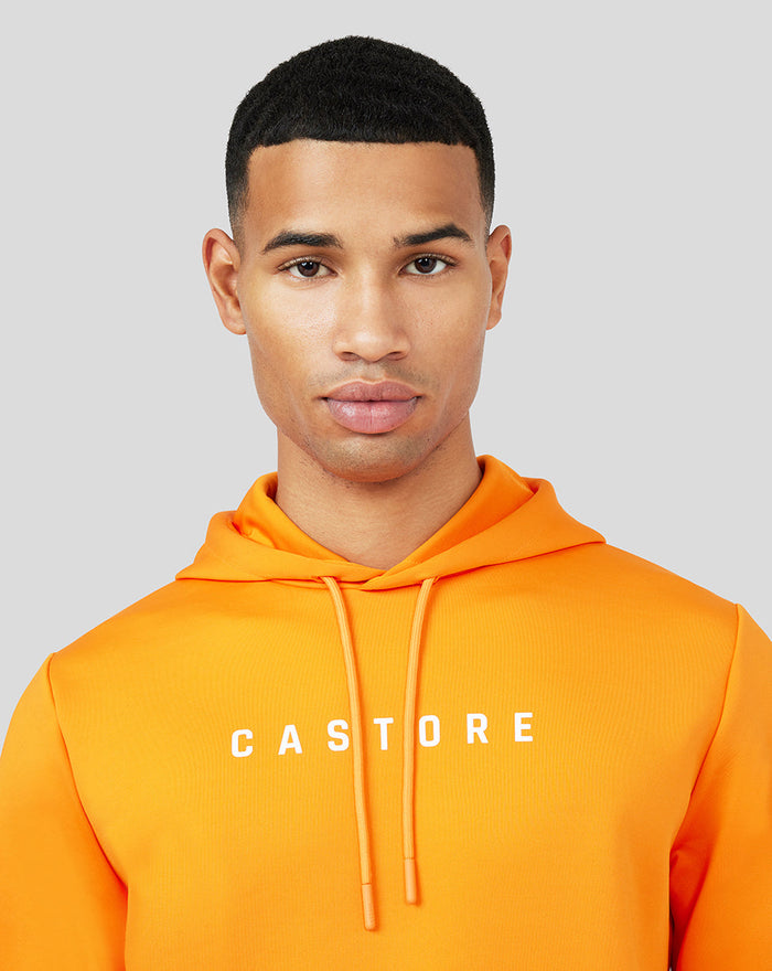 Close up of male model in bright orange Mandarin Scuba Hoody 3.0 with CASTORE across chest.