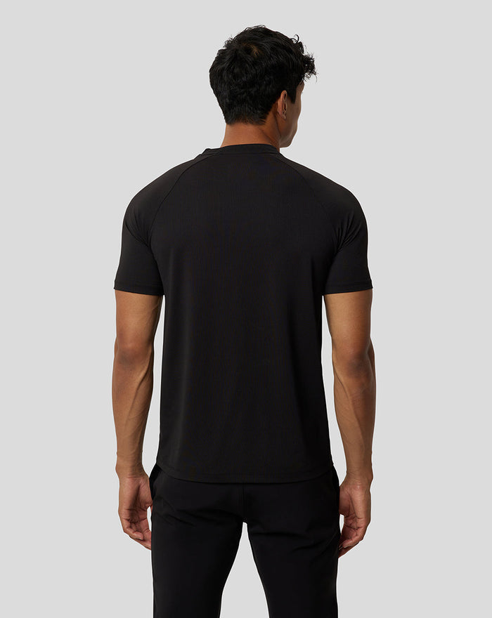 Back view of a male model in a black Onyx short sleeve training T shirt