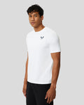 Three-quarter view of a man wearing a white Protek short sleeve training T shirt.