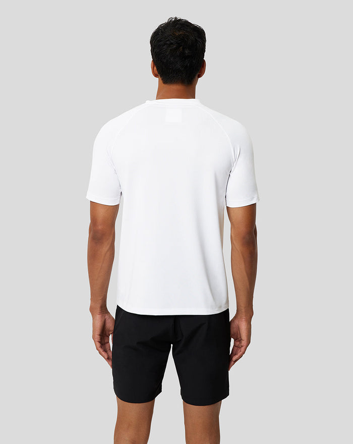 Back view of a man wearing a white Protek short sleeve training T shirt from the Ore Capsule collection