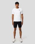 Front view of a man in a white Protek short sleeve training T shirt with chest logo from the Ore Capsule collection