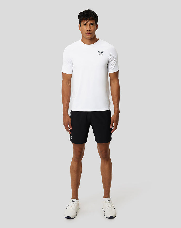 Front view of a man in a white Protek short sleeve training T shirt with chest logo from the Ore Capsule collection