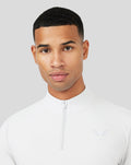 Close-up of the white Mist Metatek 1/4 Zip top showing a high neck zip and subtle chest logo