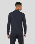 Back view of a dark Onyx Metatek 1/4 Zip top on a model showing a streamlined silhouette