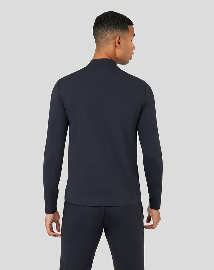 Back view of a dark Onyx Metatek 1/4 Zip top on a model showing a streamlined silhouette