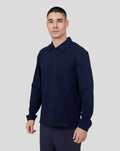 Male model wearing navy Midnight Metropolis Zip Polo with stand collar and subtle chest branding
