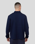 Back view of male model in navy Midnight Metropolis Zip Polo