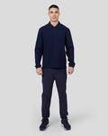 Male model facing camera in navy Midnight Metropolis Zip Polo with stand collar and quarter zip
