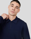 Model wearing navy Midnight Metropolis Zip Polo with stand collar and front zipper