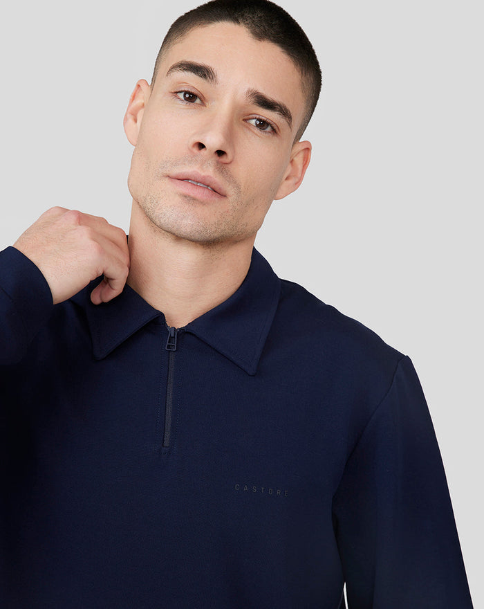 Model wearing navy Midnight Metropolis Zip Polo with stand collar and front zipper