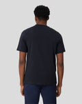 Back view of a man wearing a black Onyx Metropolis Recovery Tee with a relaxed fit