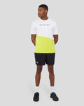 Male model wearing black 6 inch knitted shorts with a white Castore logo on the leg.