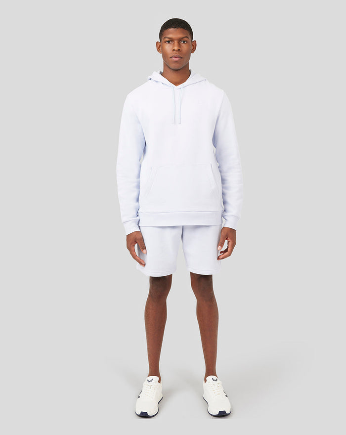 Male model in a matching Ice Blue hoodie and shorts, full-body front view.