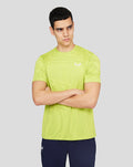 Male model in a neon lime Citrus Core Tech T Shirt with a subtle pattern and white branding on the chest.