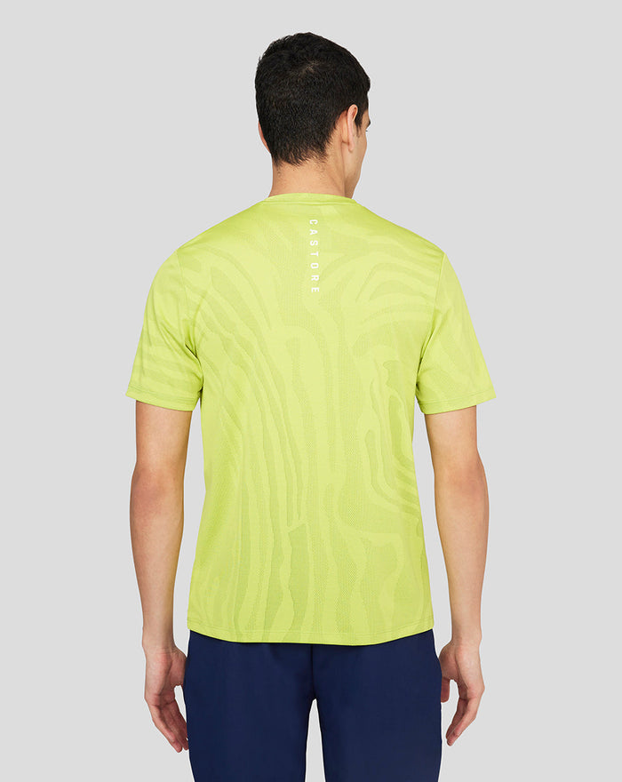 Back view of neon lime Core Tech T-Shirt with Castore branding running down the spine.